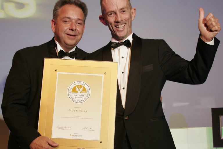 Paul Sofilas on stage receiving his Golden Guide award