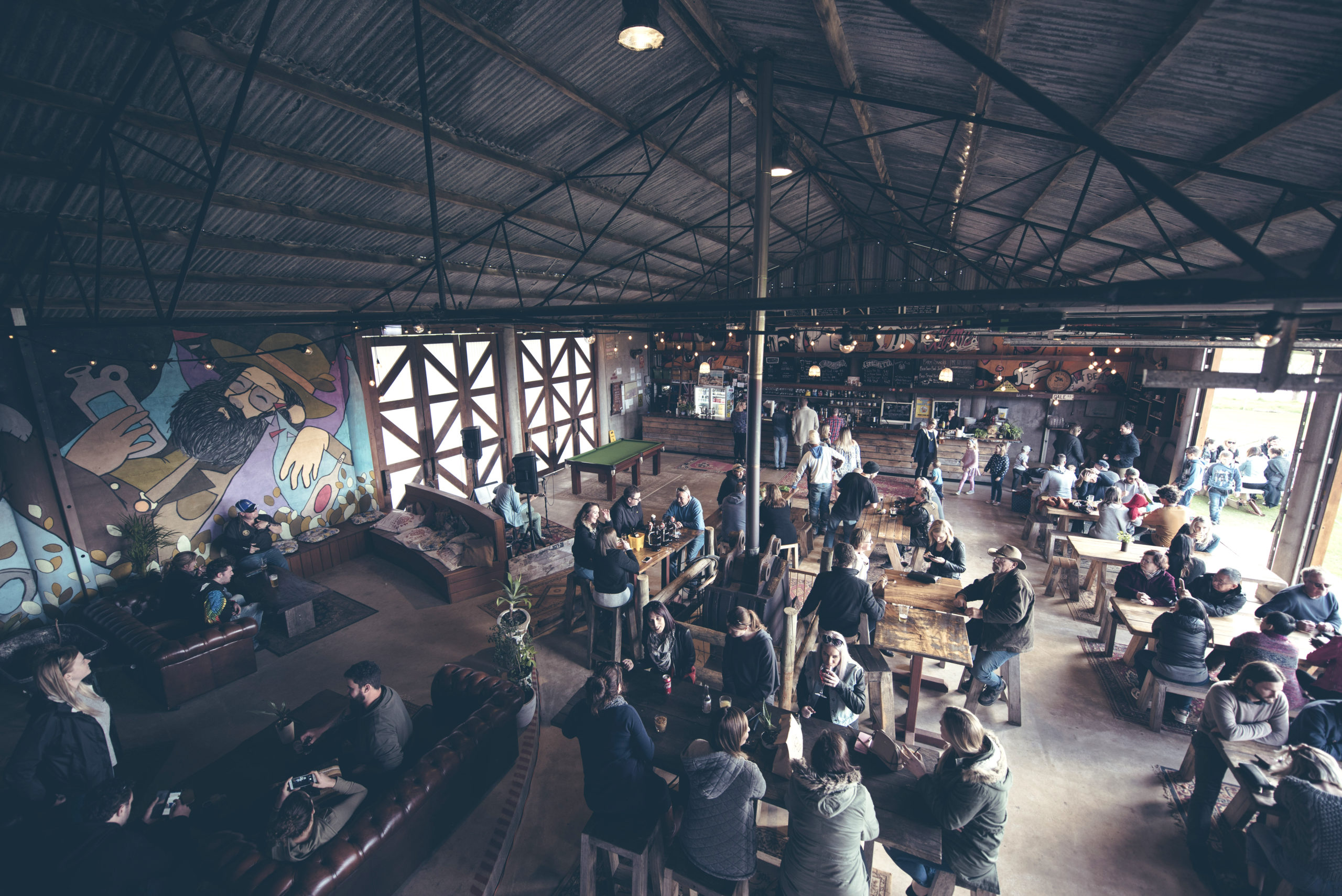 People sitting inside at Beerfarm. Credit Gordon Becker