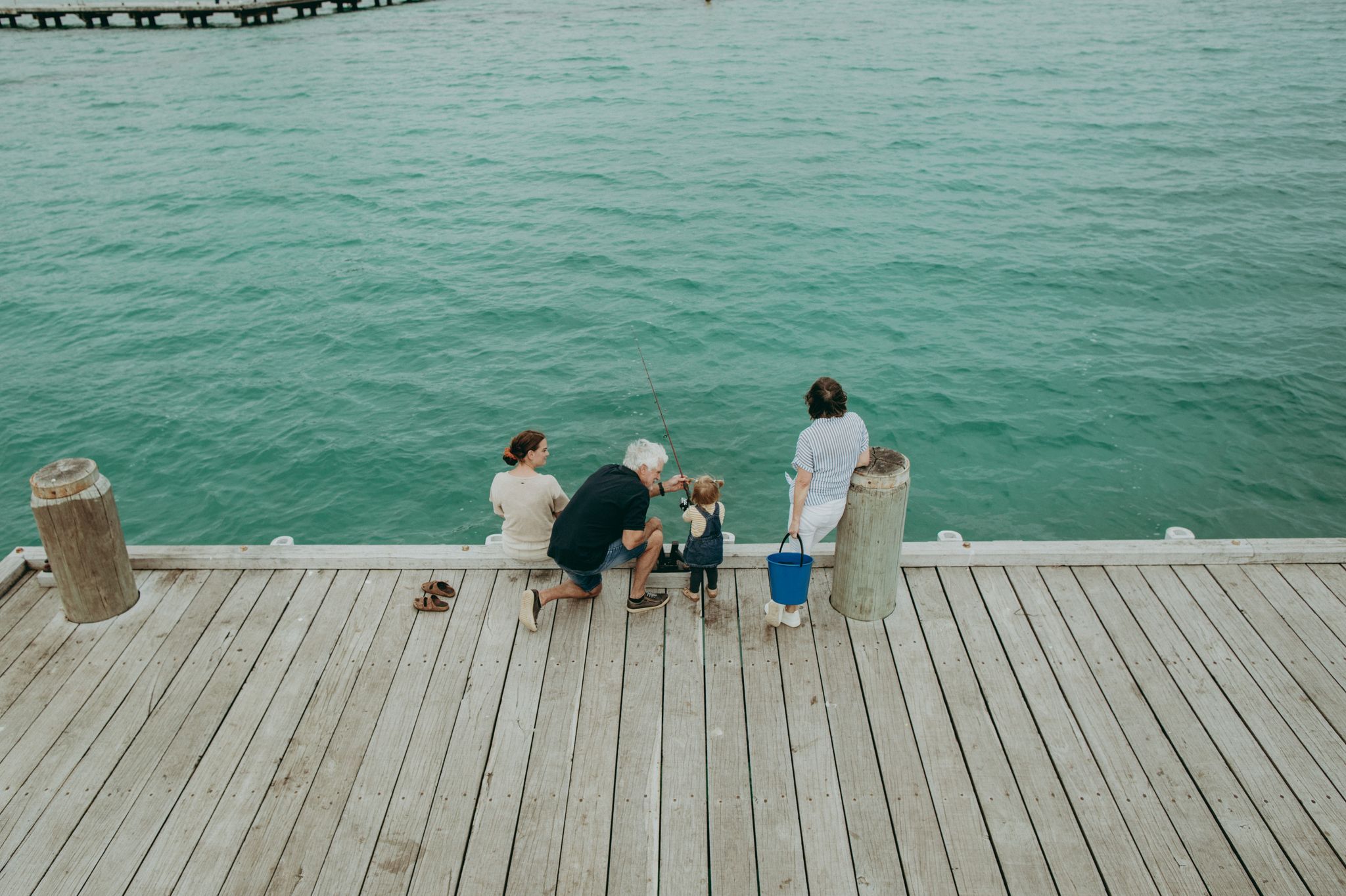 Family fishing at Busselton Jetty. Credit Ryan Murphy