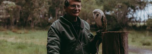 Phil and owl at Eagles Heritage. Photo credit Ryan Murphy