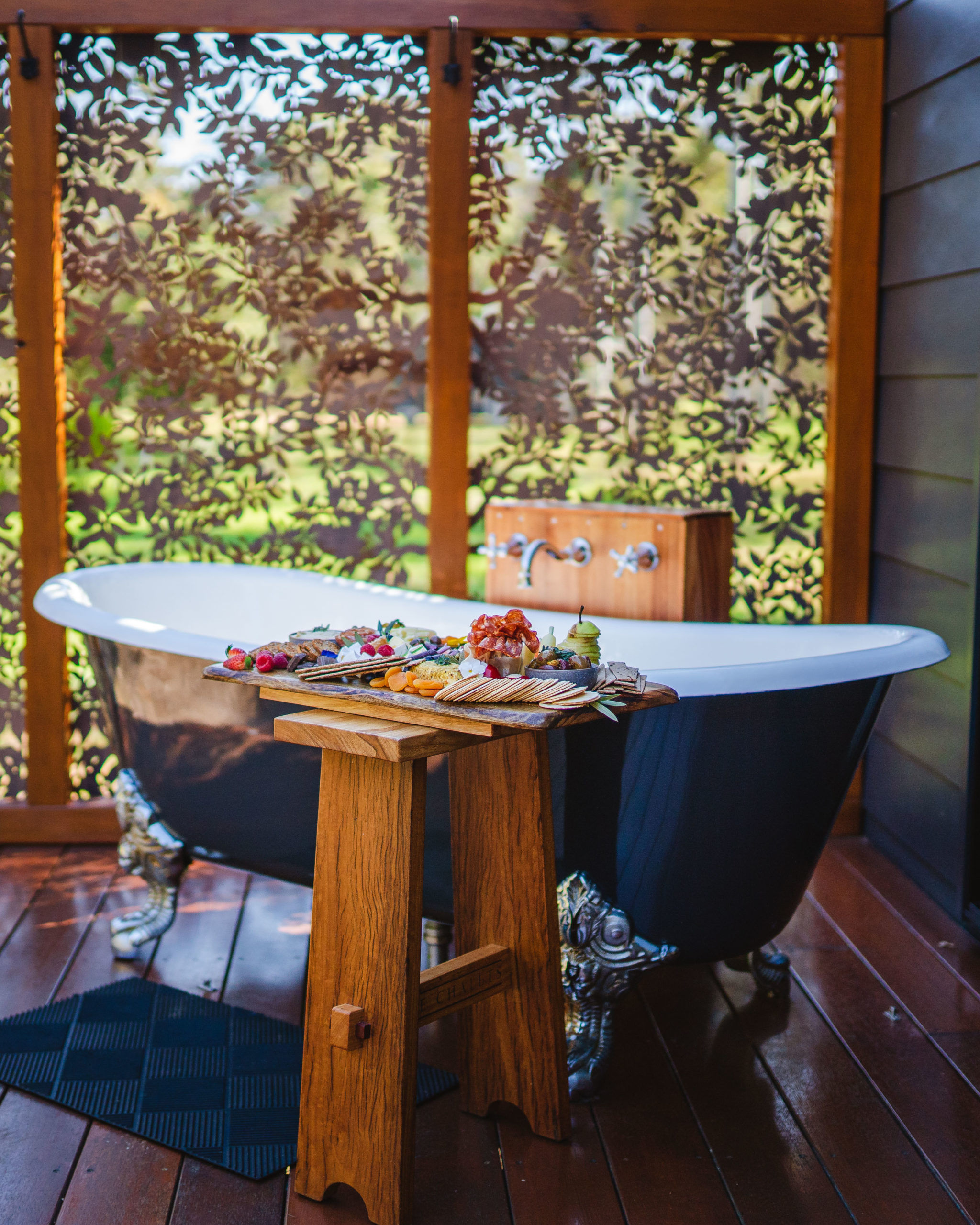 Romantic experiences - Outdoor bath with grazing board at Tree chalets. Credit Dylan Alcock.