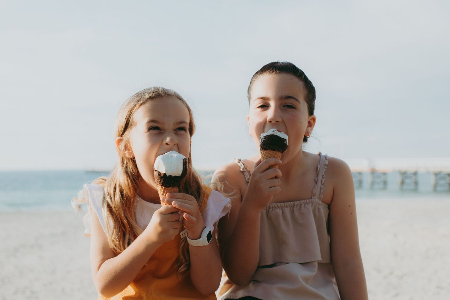 Two girls eating ice creams at Busselton Jetty. Credit Ryan Murphy