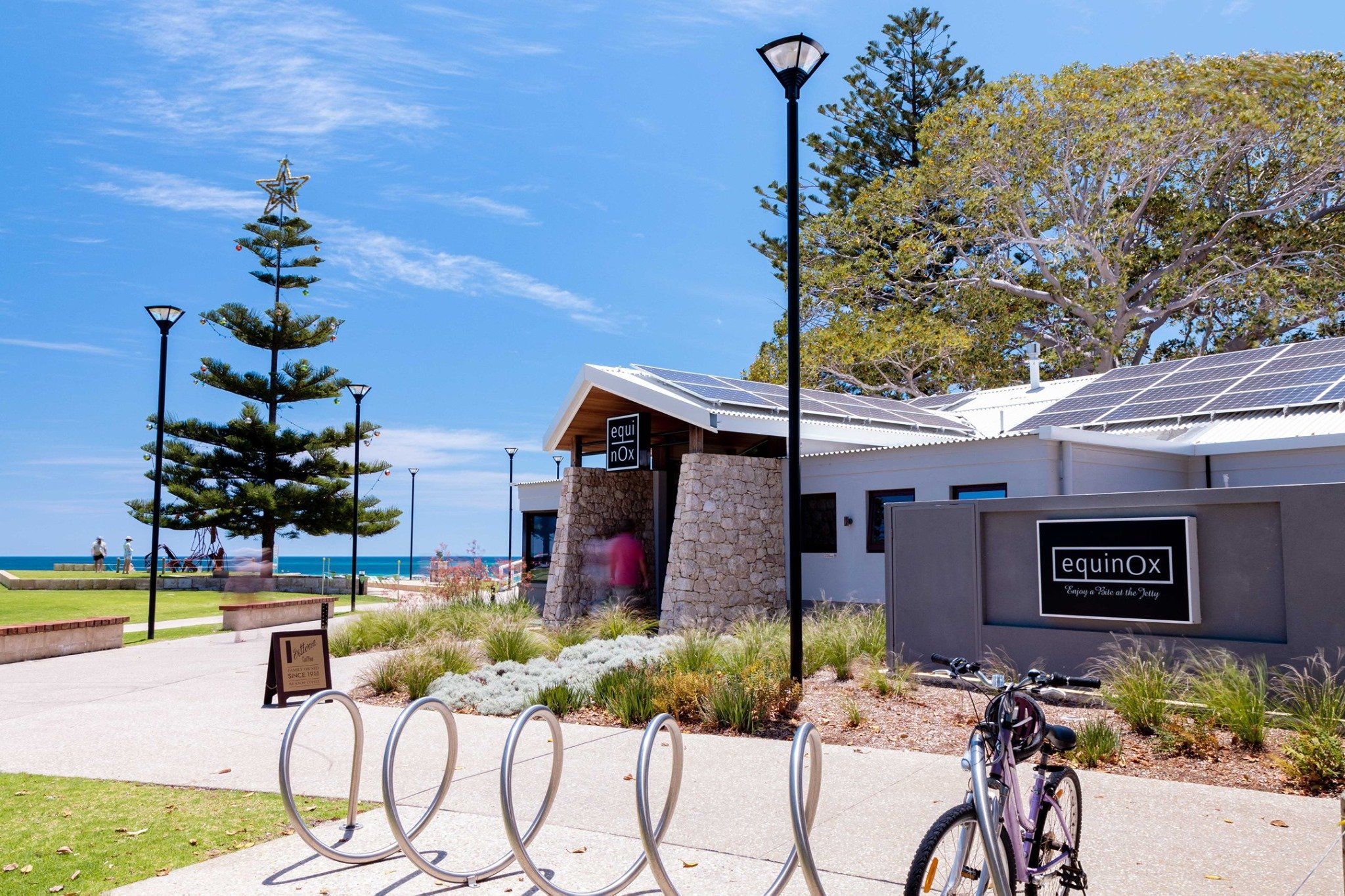 Exterior of Equinox Busselton, with Geographe Bay in the background