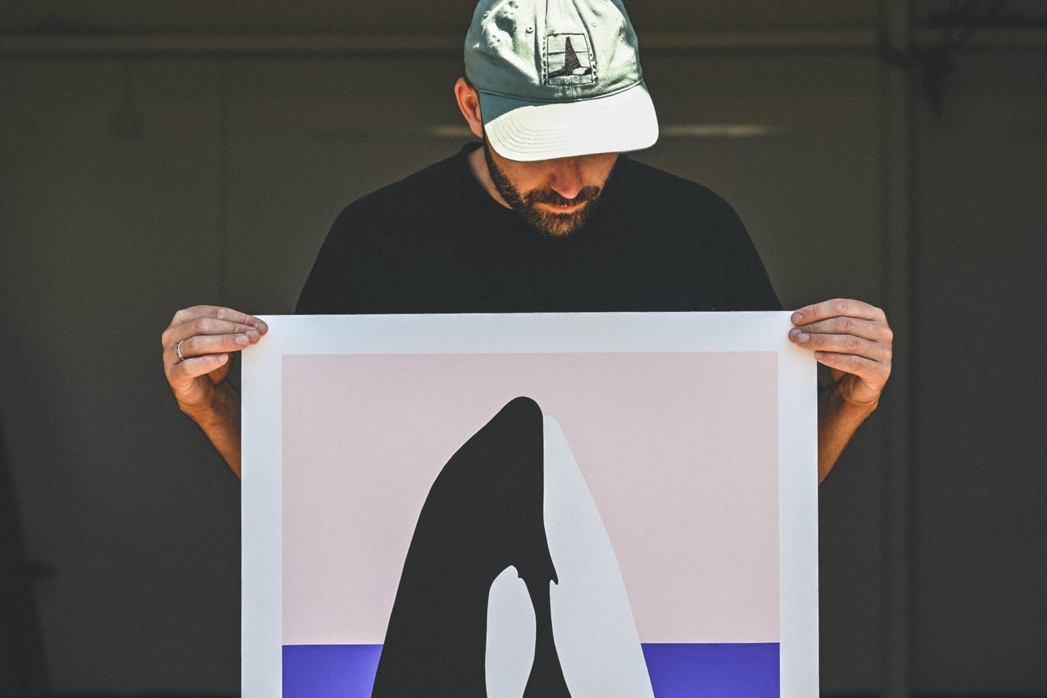 Ian Daniell holding his orca print. Part of Margaret River Region Open Studios.