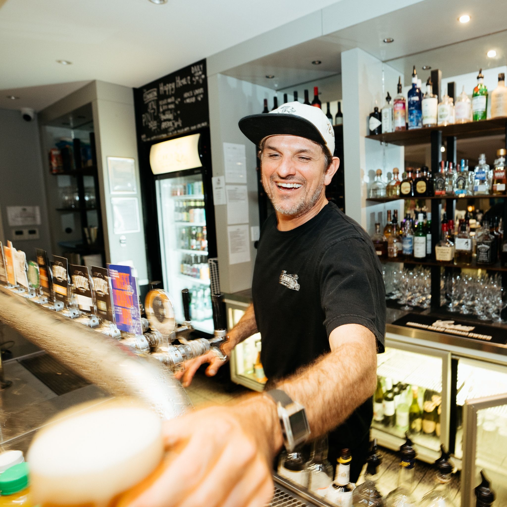 Tony behind the bar at The Common, in Prevally Margaret River