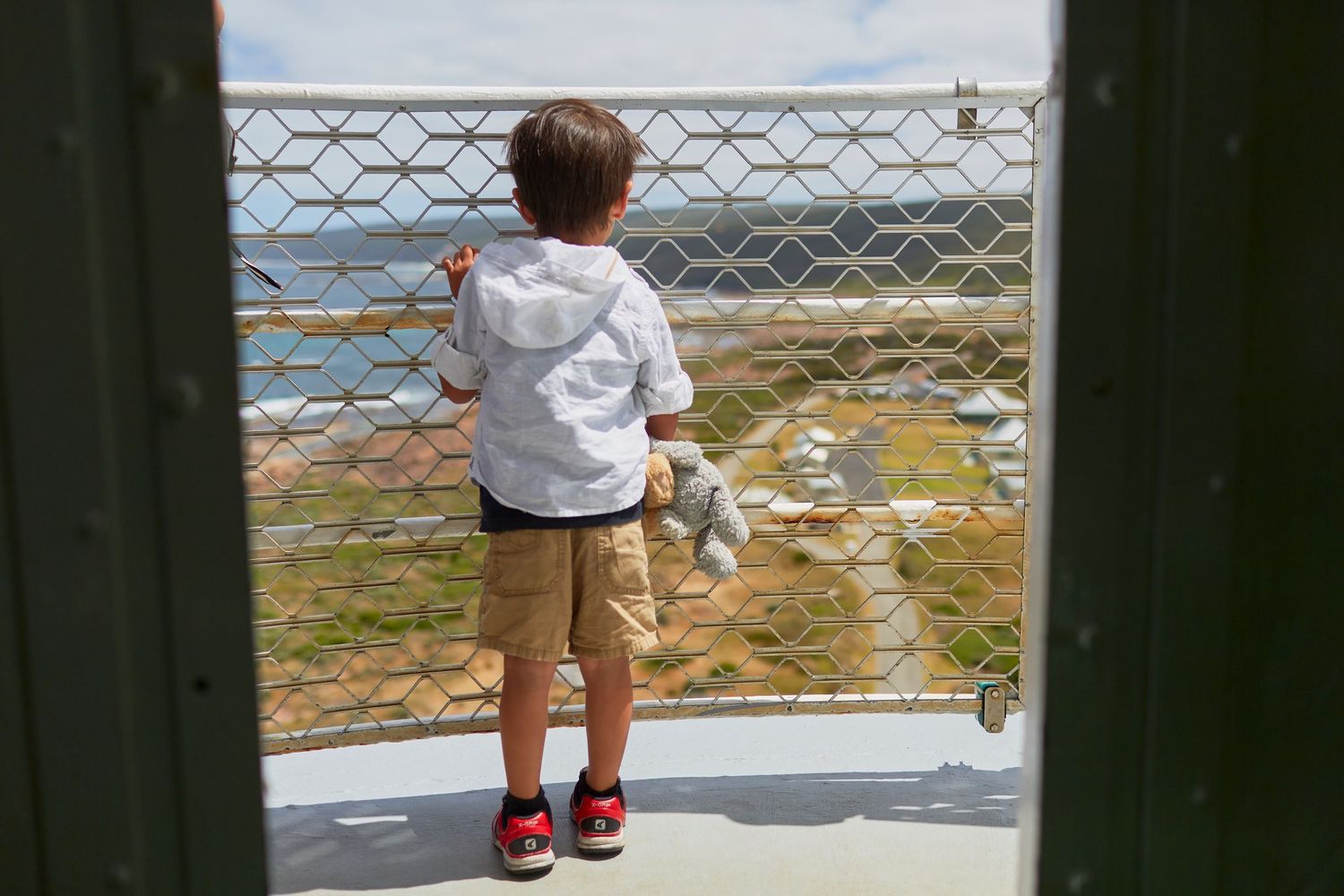 Child looking out from the viewing platform at Cape Leeuwin Lighthouse. Credit Tim Campbell