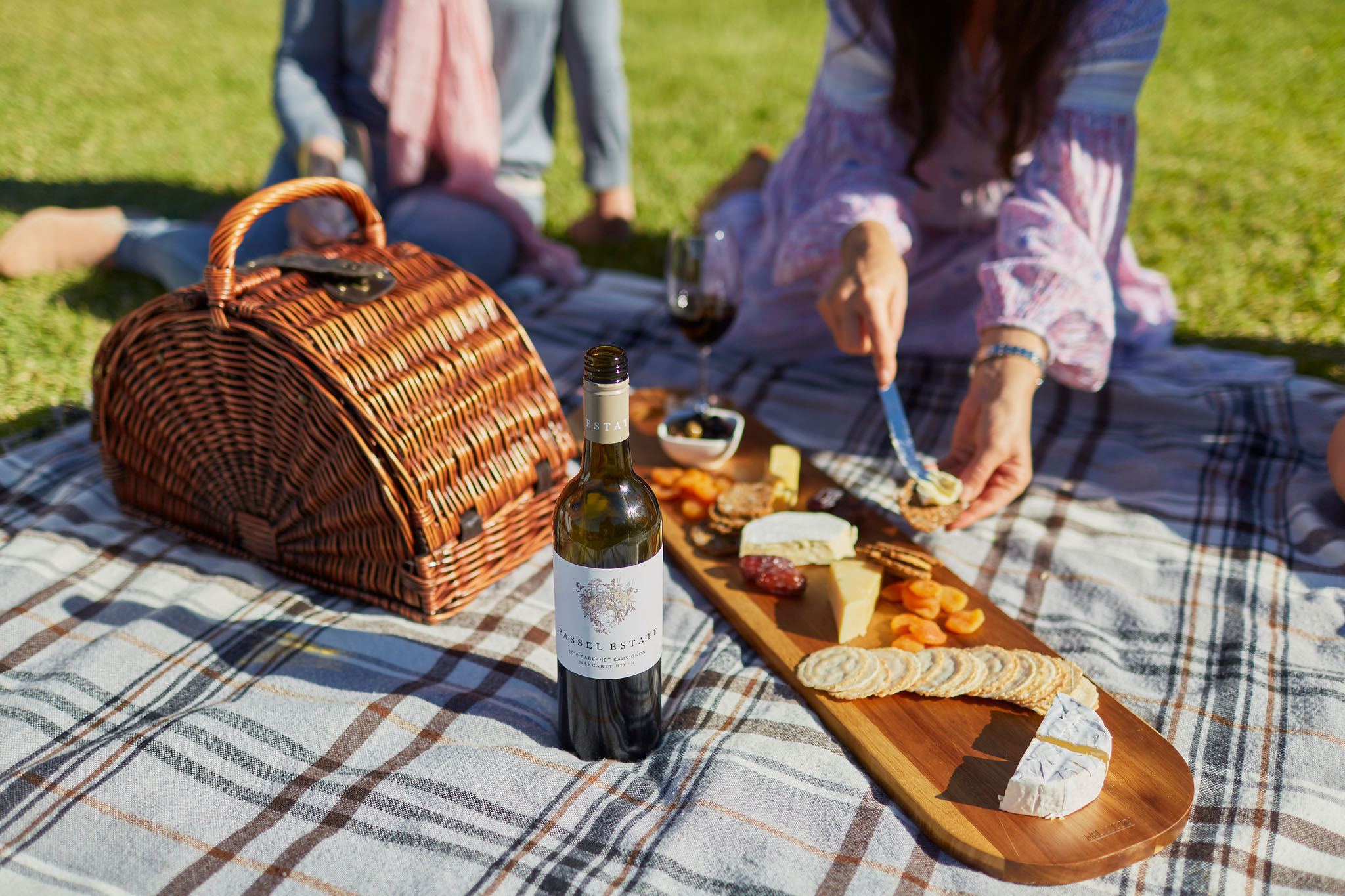 Cheeseboard and wine on the lawn at Passel Estate. Credit Tim Campbell.