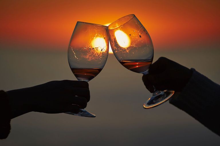 Sunset and wine cheering