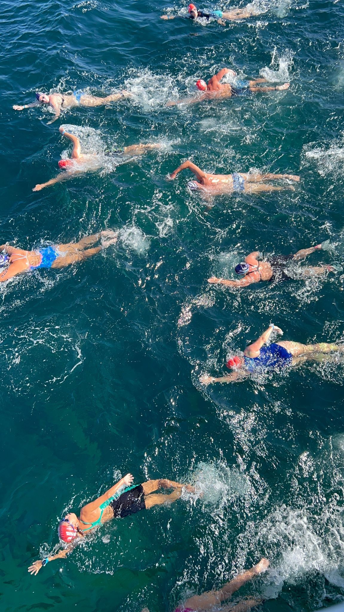 Aerial shot of people swimming at the 2022 Busselton Jetty Swim.