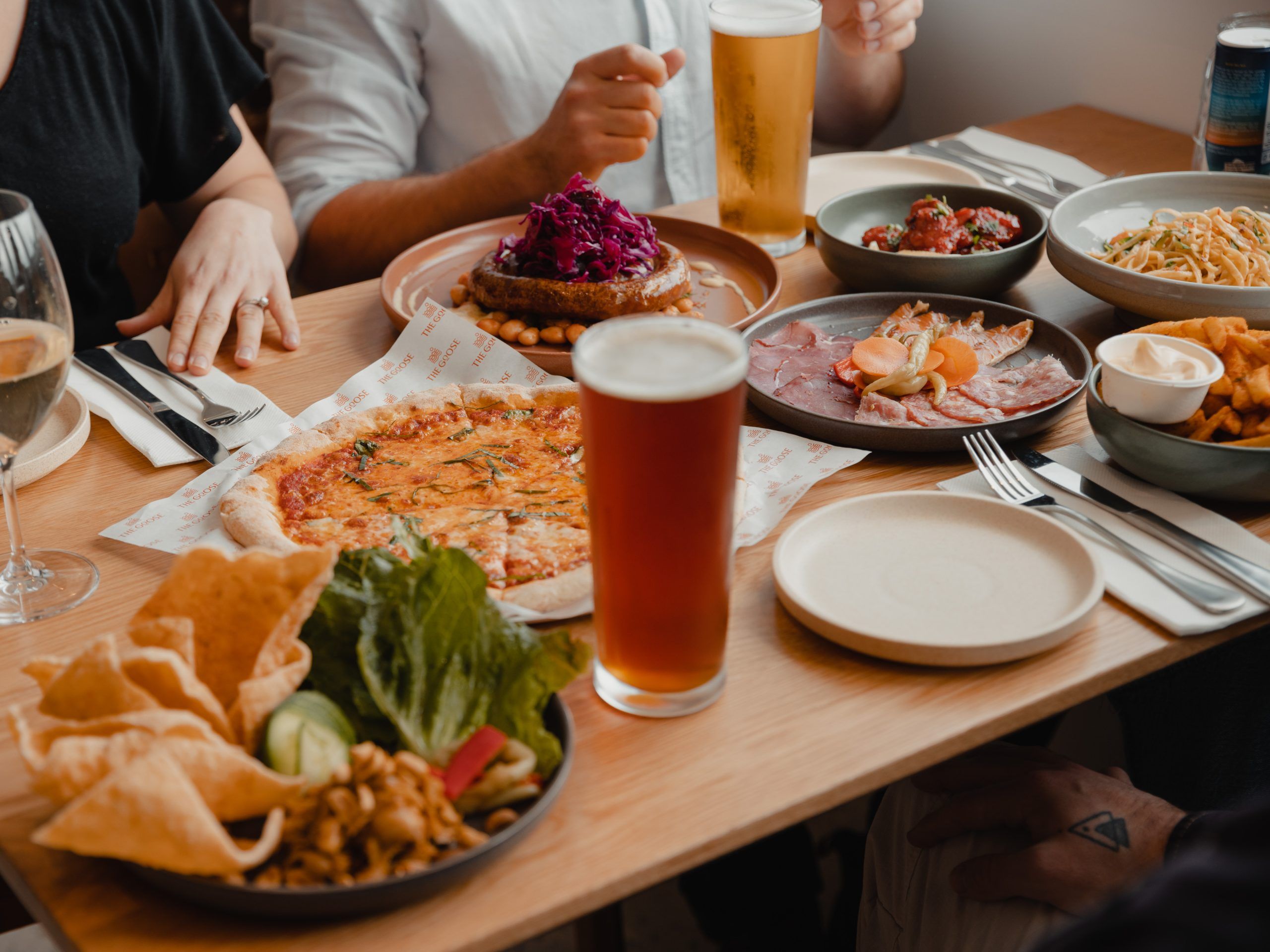 close up image of food on a table and beer