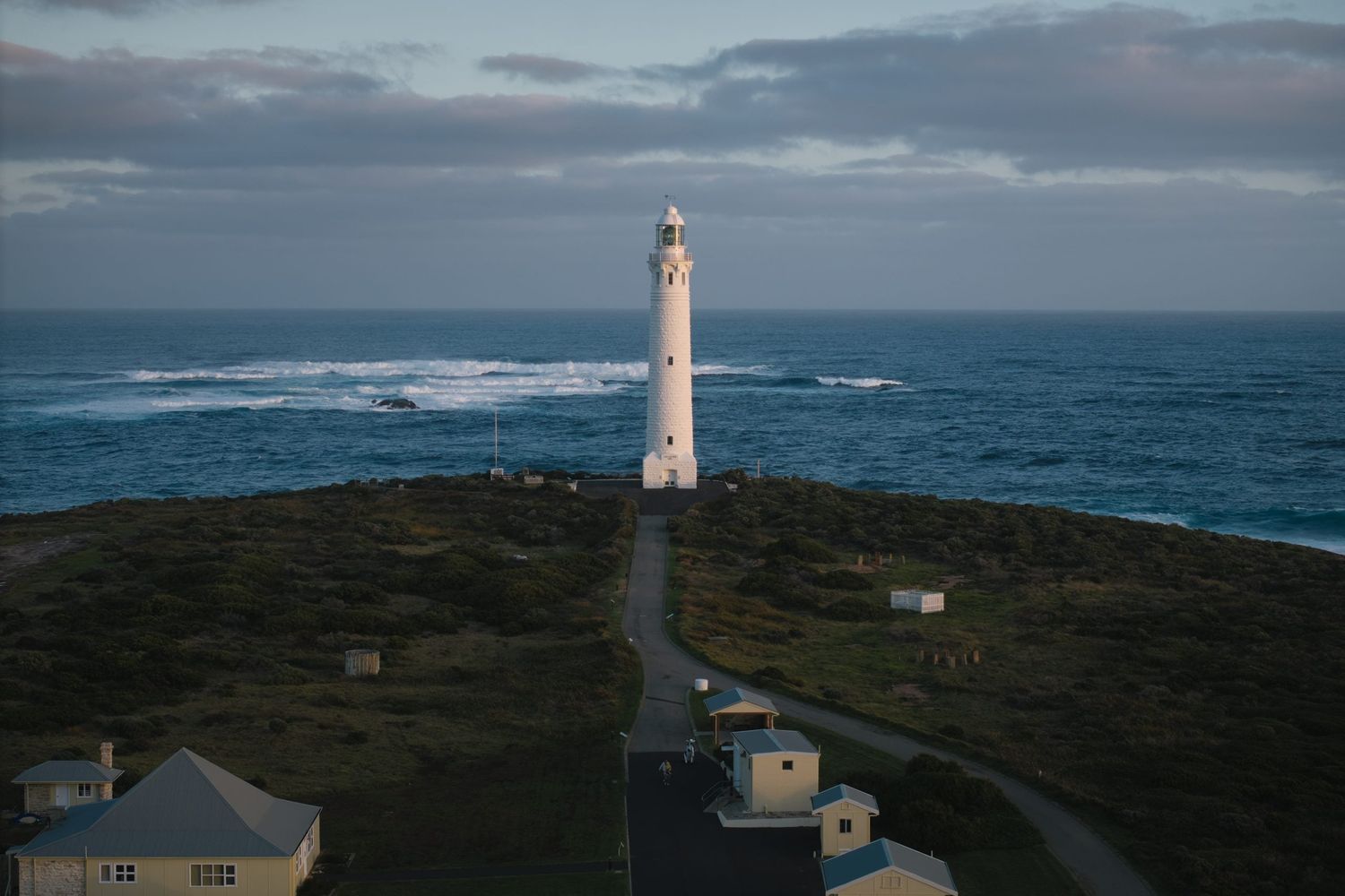 Cape Leeuwin Lighthouse from a distance with sea in the background