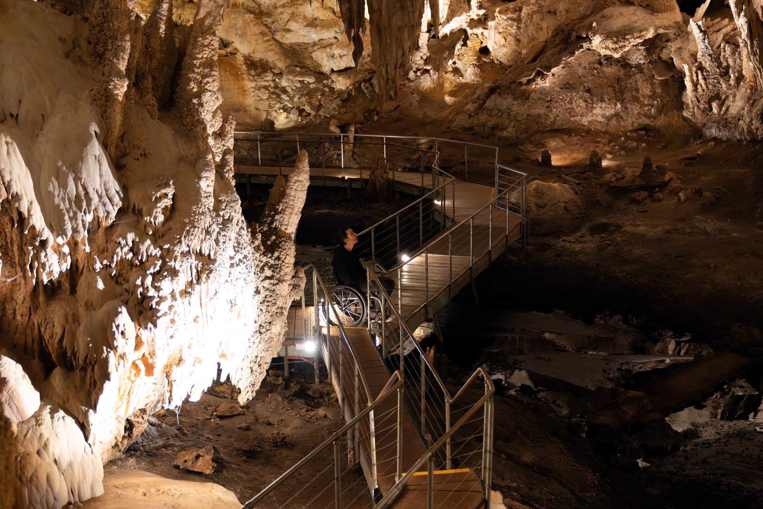 A wheelchair user inside Mammoth Caves first chamber