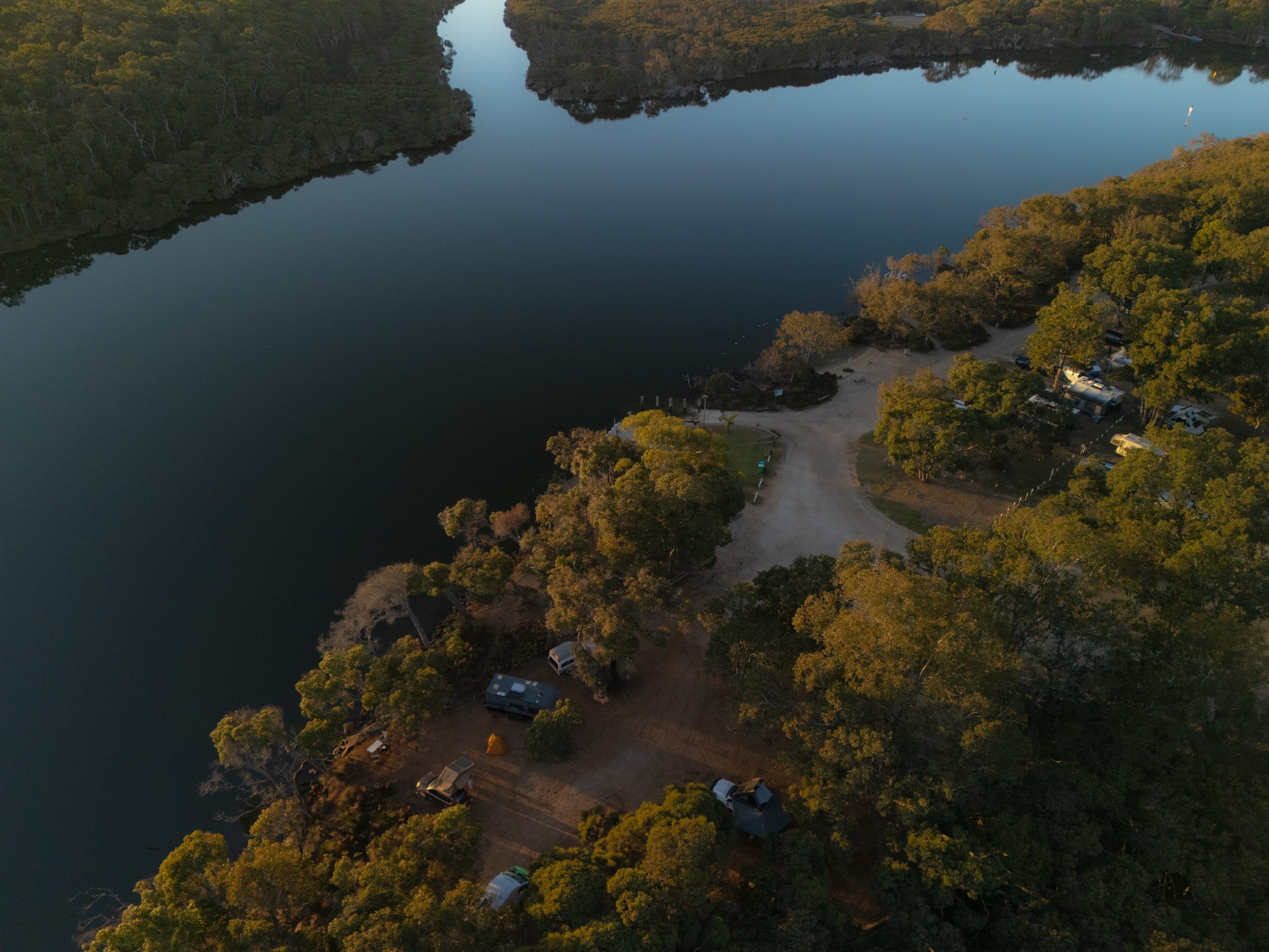 Aerial photo of the Blackwood River from the Molloy Hideaway Holiday Park. The river is perfectly still and looks like glass.