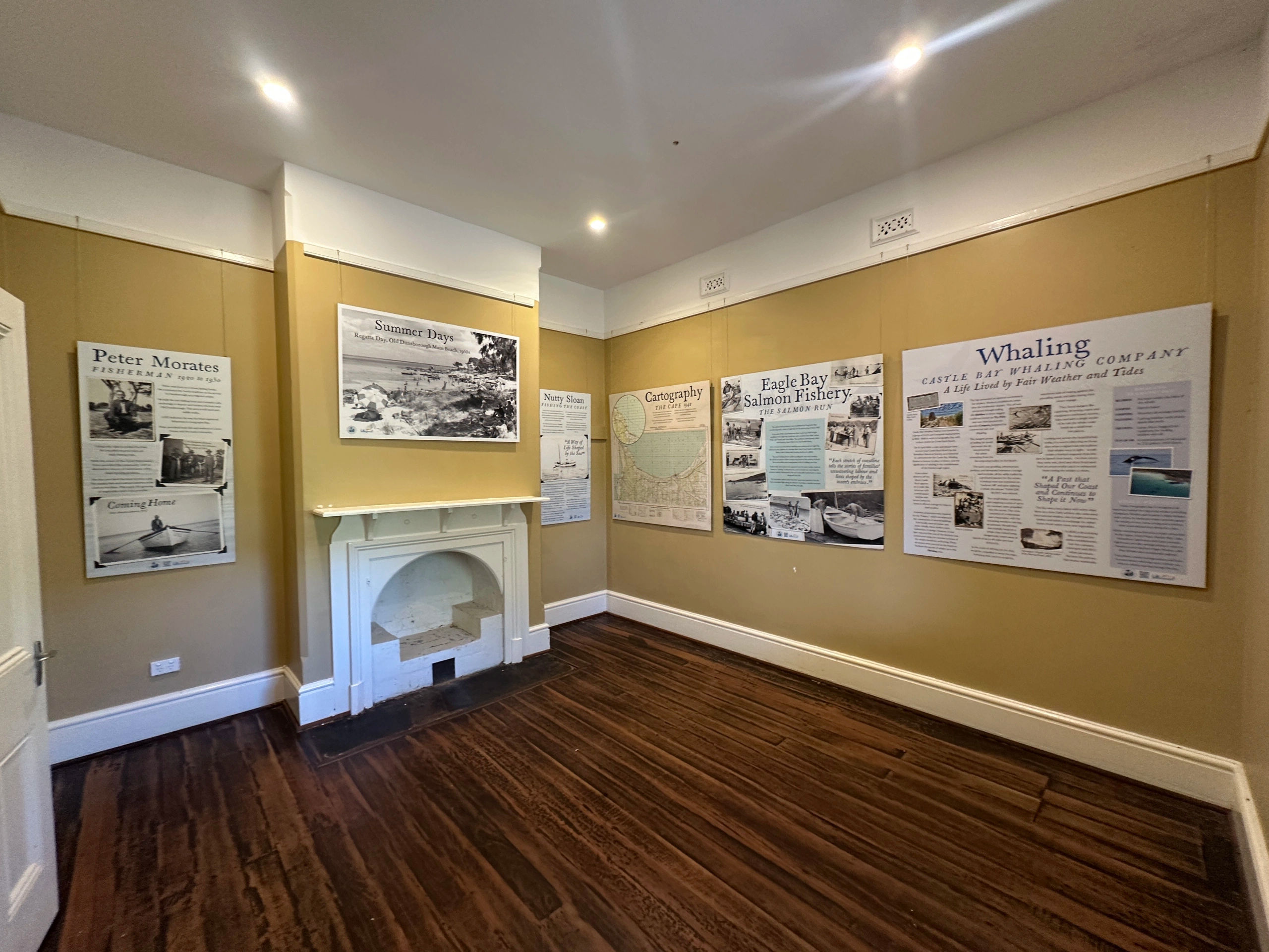 Information and photos hanging inside a historical cottage at Cape Naturaliste Lighthouse explaining the history of the area.